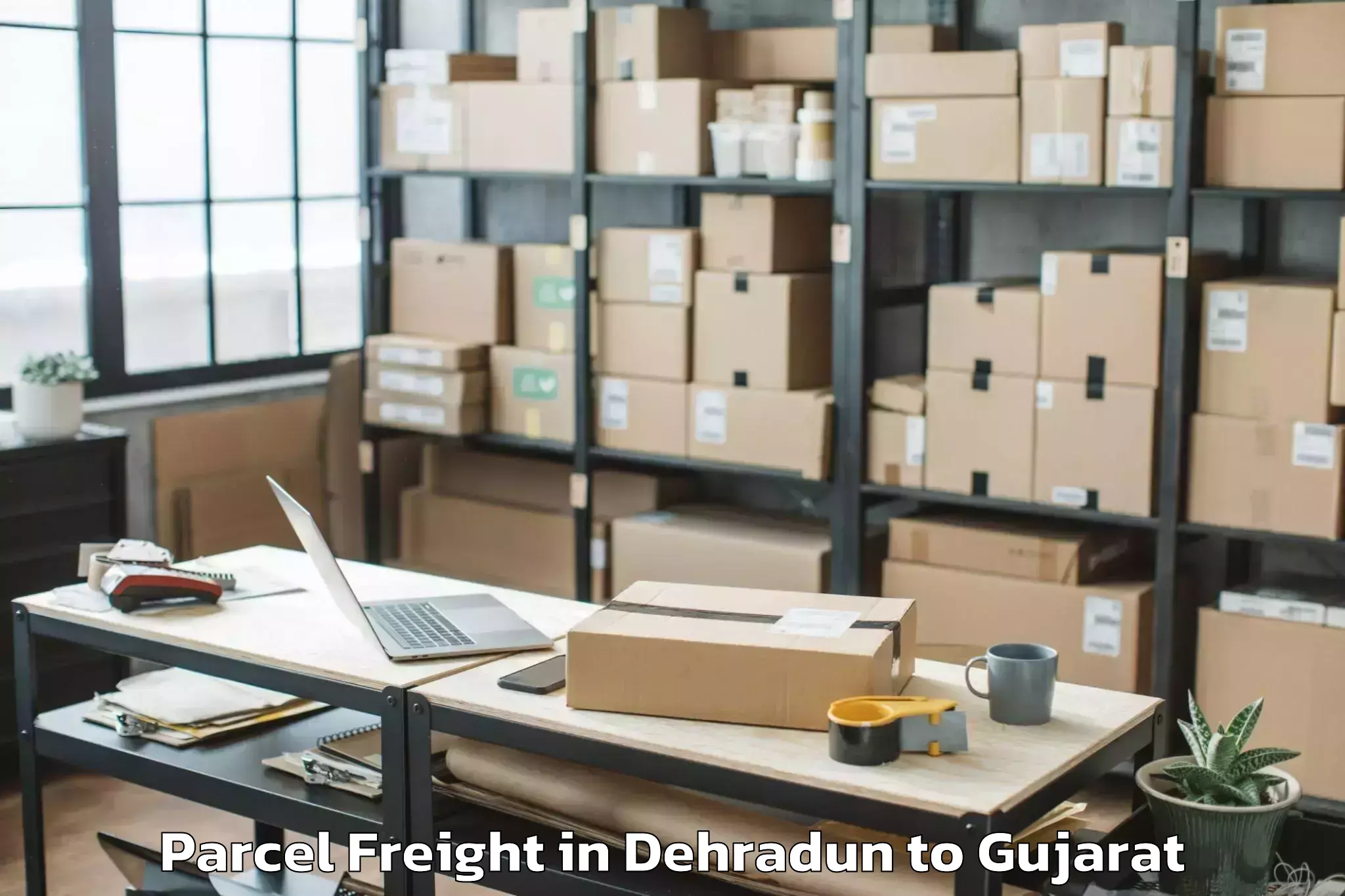 Discover Dehradun to Indus University Ahmedabad Parcel Freight